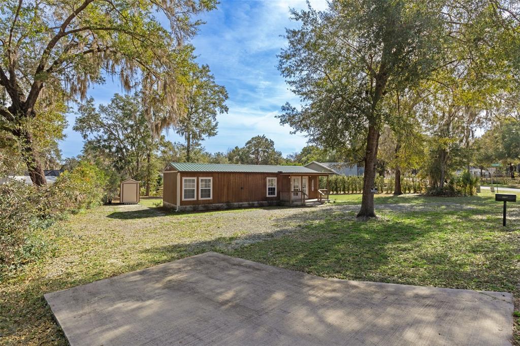 6287 North Crew Terrace Hernando, FL 34442 - Photo 14 of 38 a house with trees in front of it