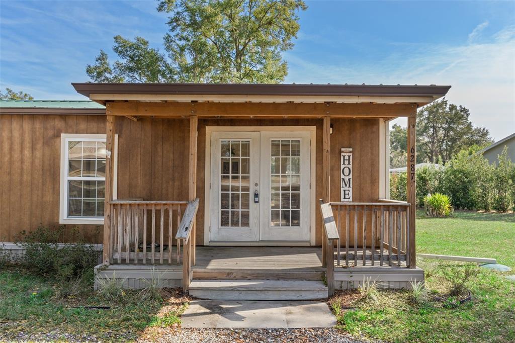6287 North Crew Terrace Hernando, FL 34442 - Photo 15 of 38 a view of a house with a wooden fence