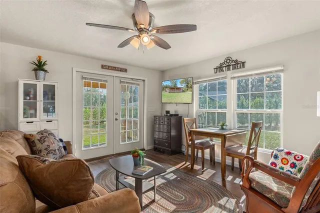 a white kitchen with a refrigerator a stove a sink and cabinetry