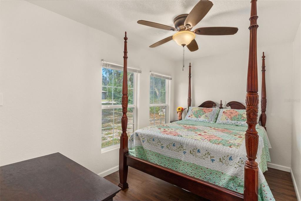 6287 North Crew Terrace Hernando, FL 34442 - Photo 23 of 38 a bedroom with a bed window and a ceiling fan