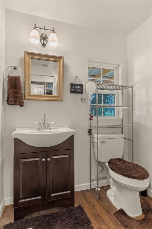 6287 North Crew Terrace Hernando, FL 34442 - Photo 26 of 38 a bathroom with a toilet sink and mirror