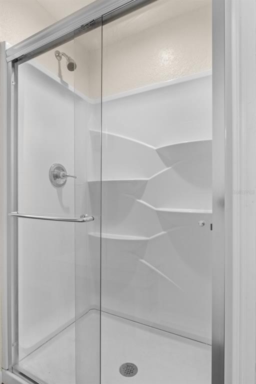 6287 North Crew Terrace Hernando, FL 34442 - Photo 28 of 38 a bathroom with a glass shower door