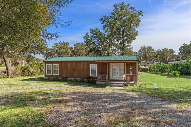a house view with a backyard space