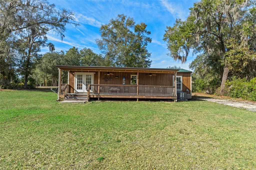 6287 North Crew Terrace Hernando, FL 34442 - Photo 36 of 38 a view of a house with backyard and a tree