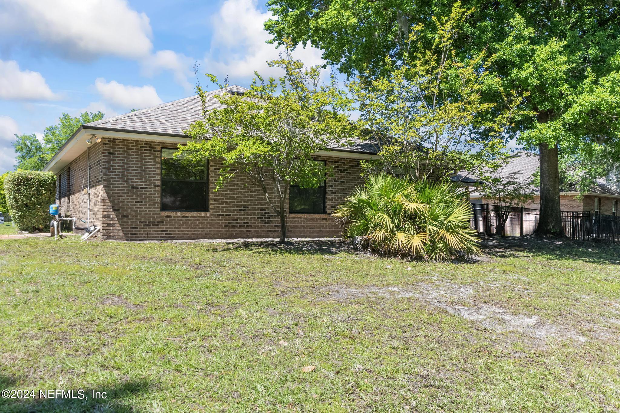 2949 Turning Leaf Lane Jacksonville, FL 32221 - Photo 101 of 116 a house with a tree in front of it