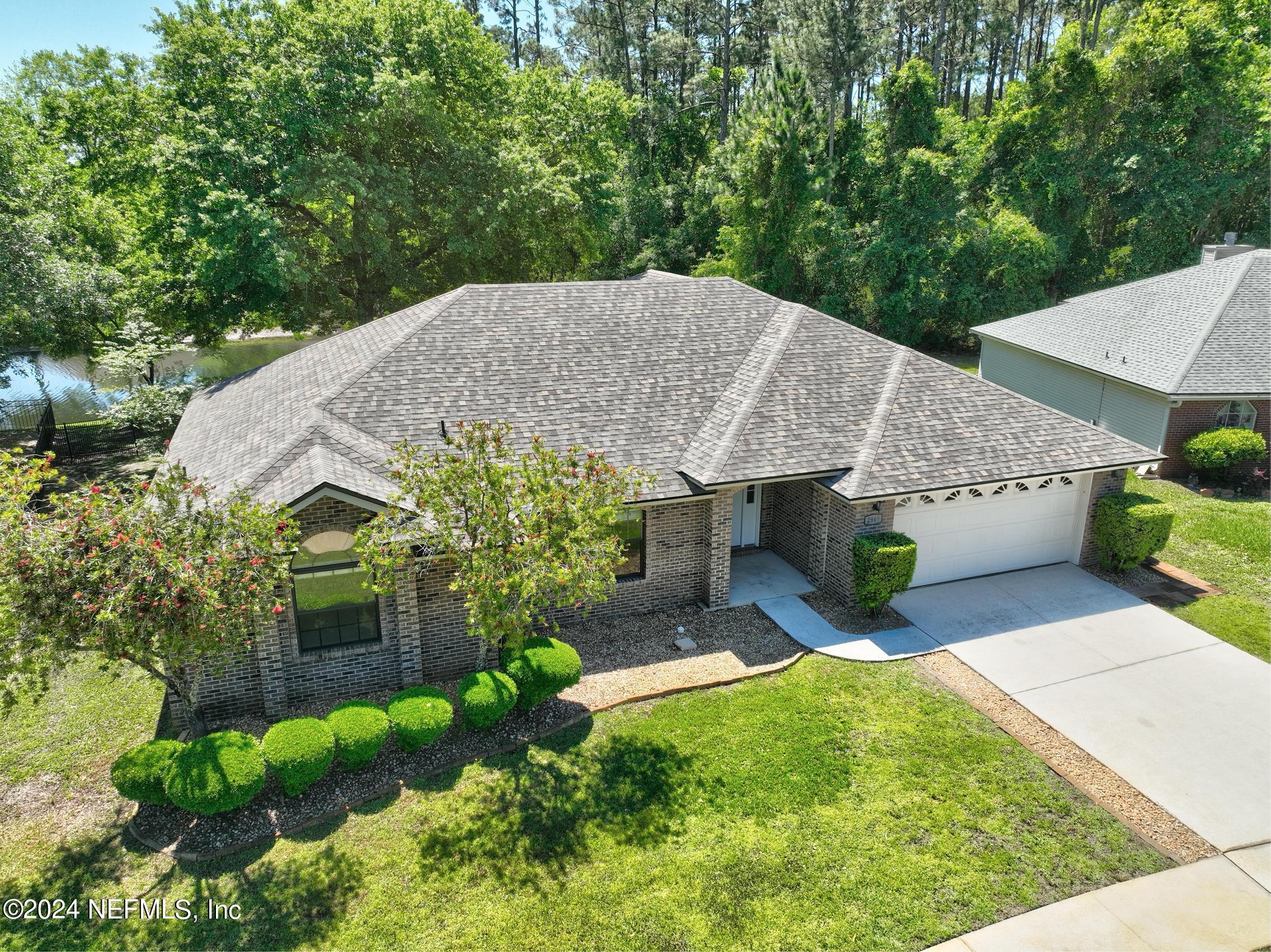 2949 Turning Leaf Lane Jacksonville, FL 32221 - Photo 108 of 116 a view of a house with a yard potted plants
