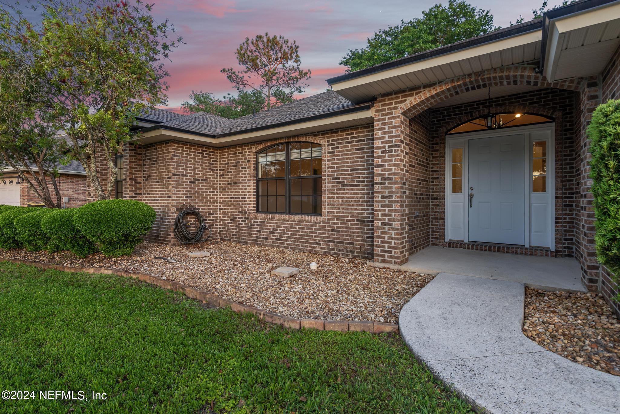 2949 Turning Leaf Lane Jacksonville, FL 32221 - Photo 14 of 116 a front view of a house with a yard