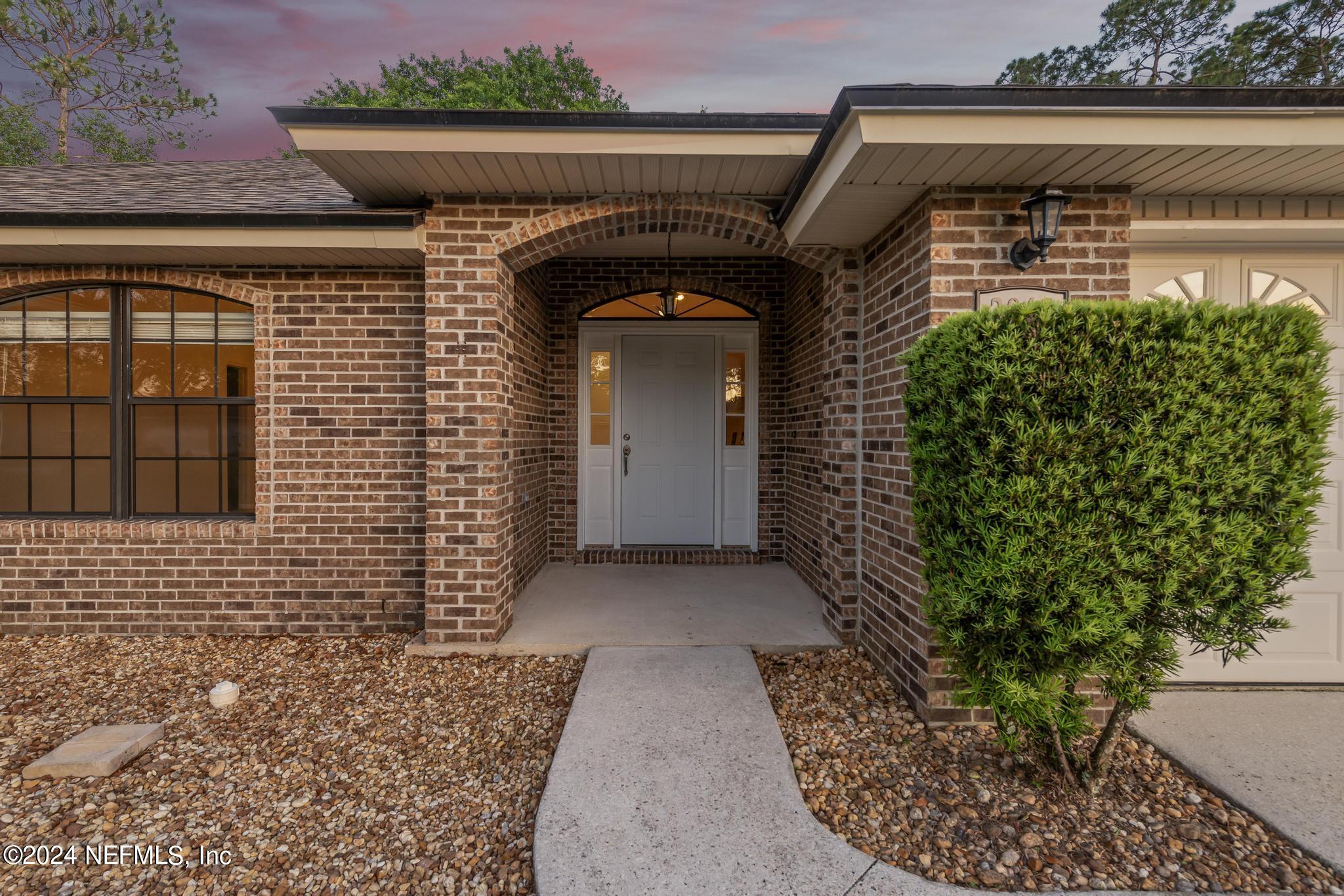 2949 Turning Leaf Lane Jacksonville, FL 32221 - Photo 16 of 116 a front view of a house with garden