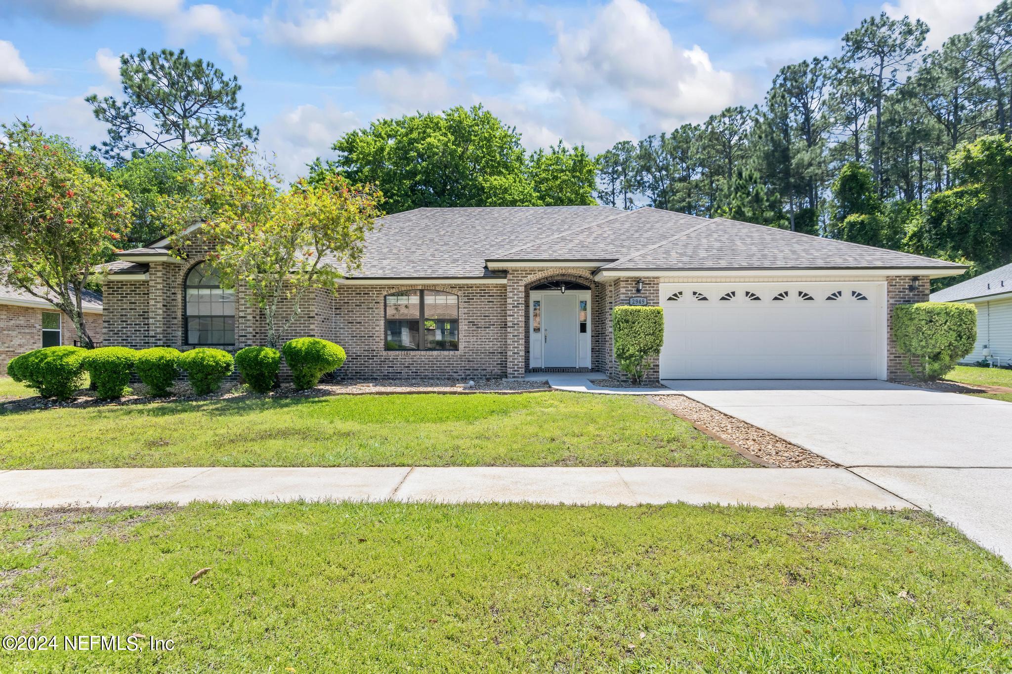 2949 Turning Leaf Lane Jacksonville, FL 32221 - Photo 19 of 116 a view of a house with a garden