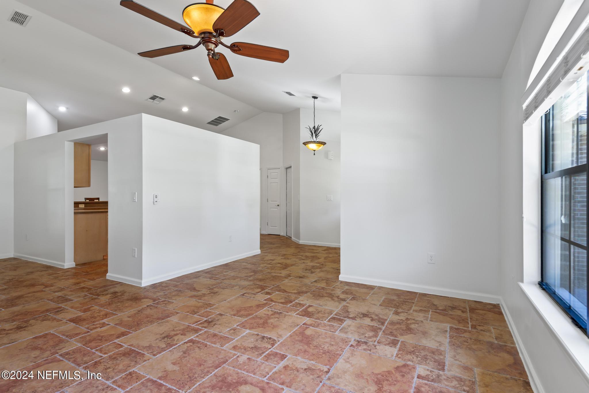 2949 Turning Leaf Lane Jacksonville, FL 32221 - Photo 25 of 116 a view of a livingroom with a ceiling fan and window