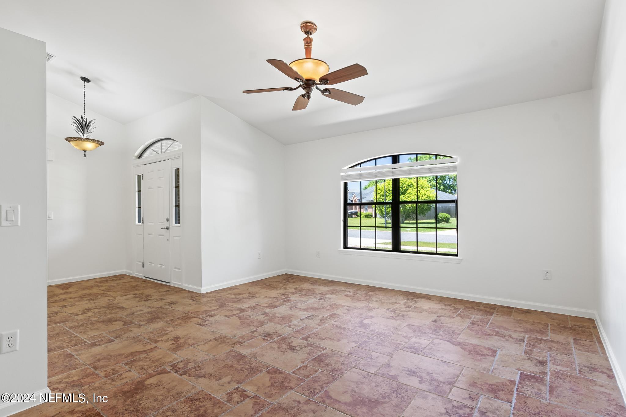 2949 Turning Leaf Lane Jacksonville, FL 32221 - Photo 30 of 116 a view of a livingroom with a ceiling fan and window