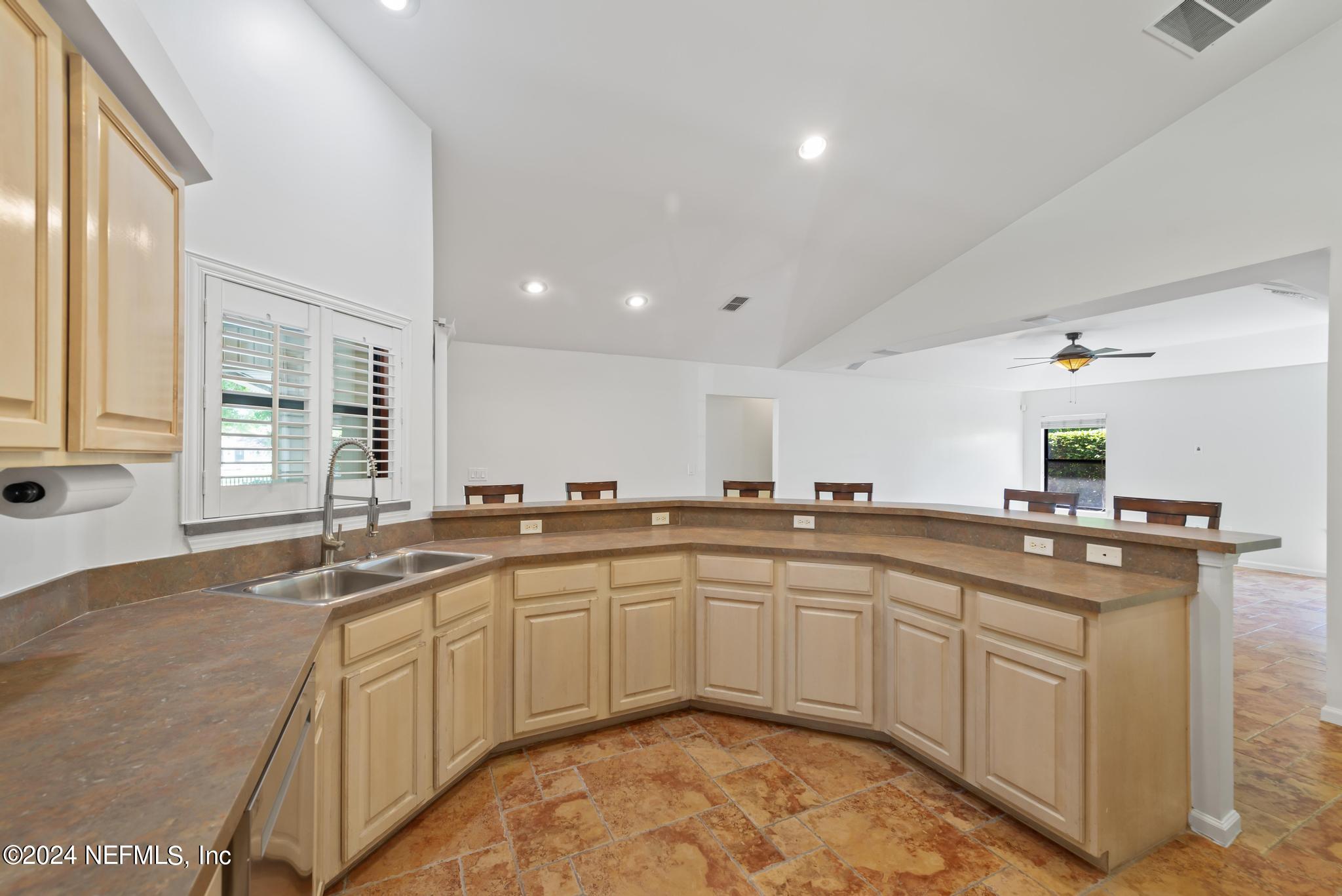 2949 Turning Leaf Lane Jacksonville, FL 32221 - Photo 36 of 116 a kitchen with a sink stove and cabinets