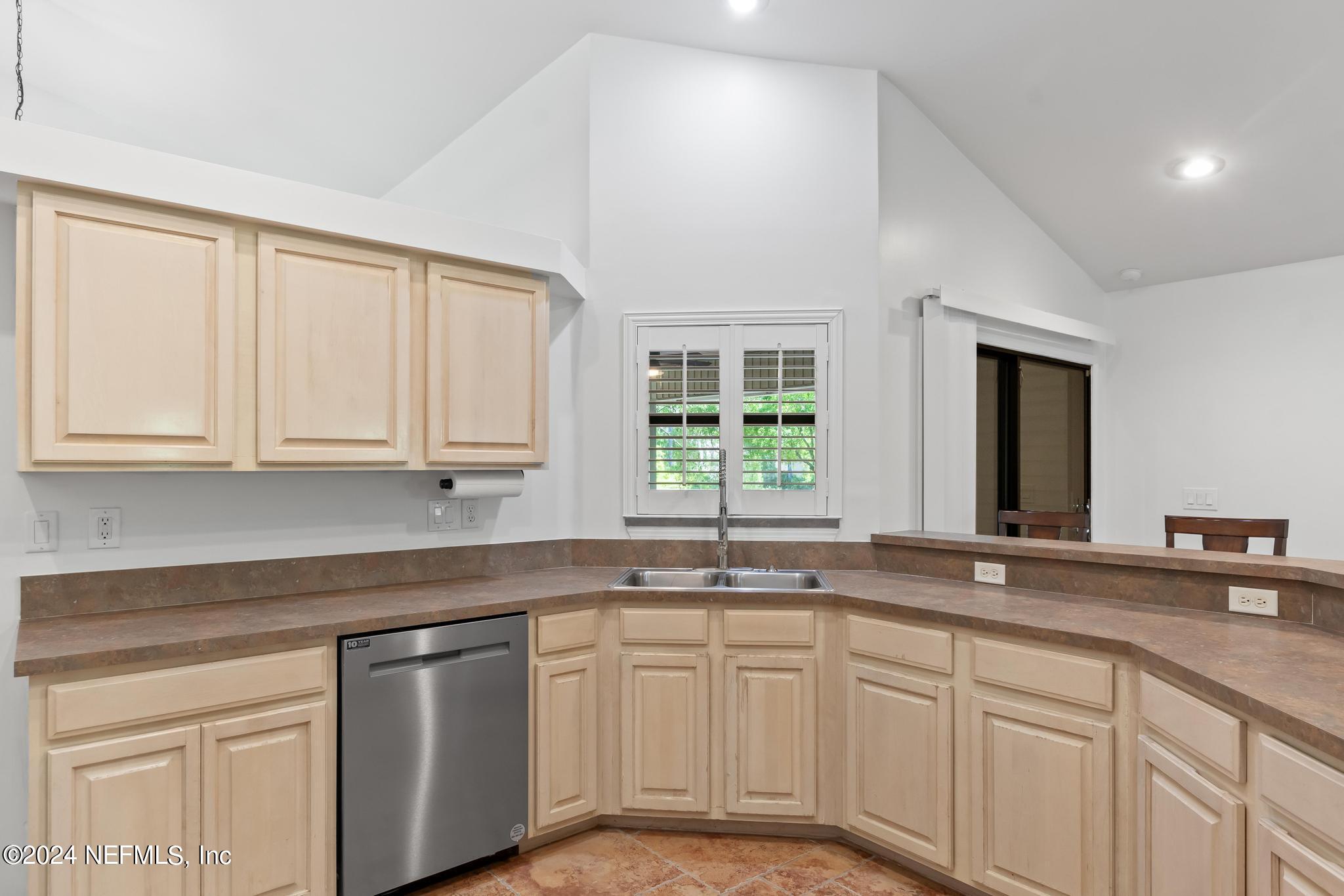 2949 Turning Leaf Lane Jacksonville, FL 32221 - Photo 37 of 116 a kitchen with granite countertop white cabinets and a sink