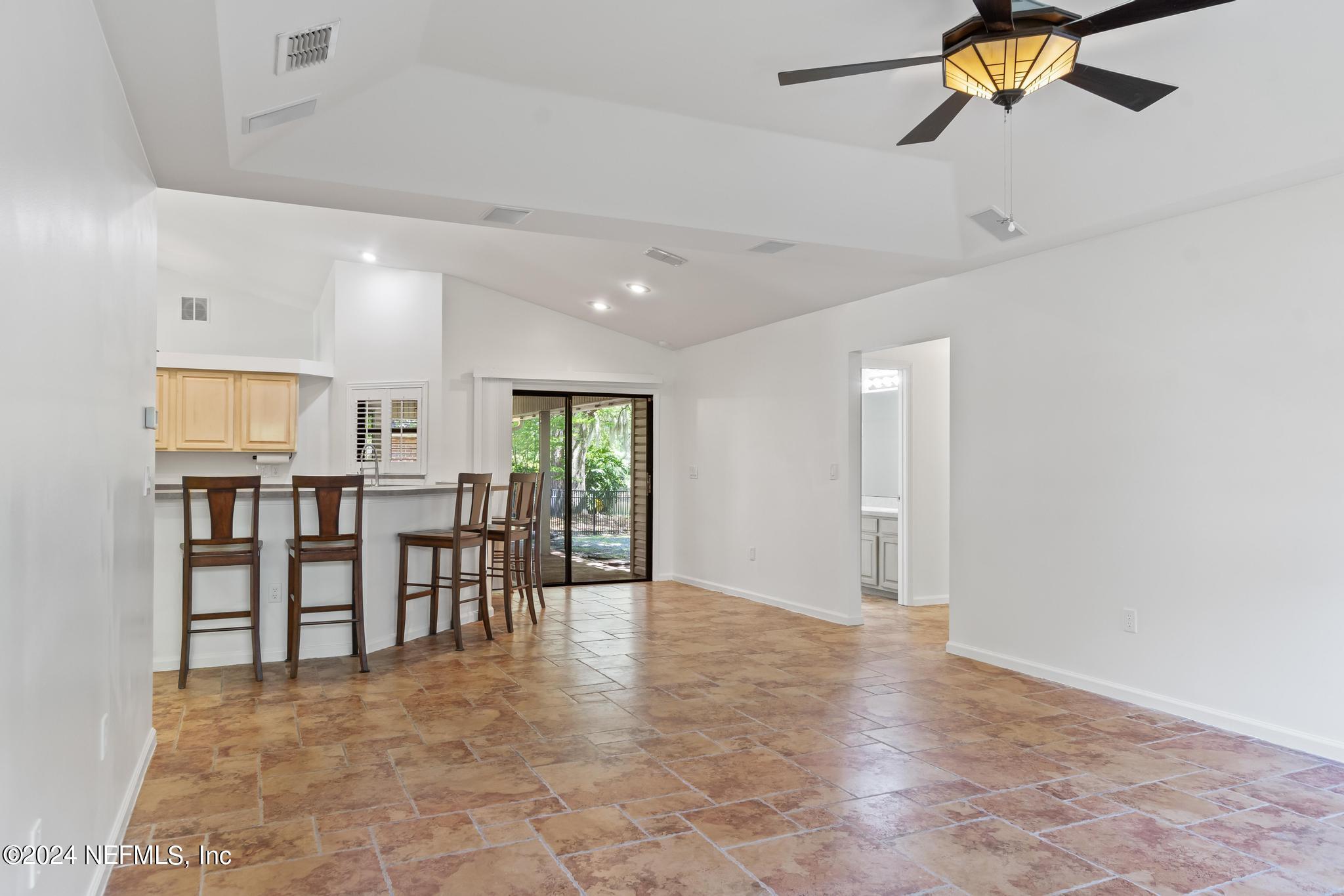 2949 Turning Leaf Lane Jacksonville, FL 32221 - Photo 52 of 116 a view of kitchen and dining area with chandelier fan