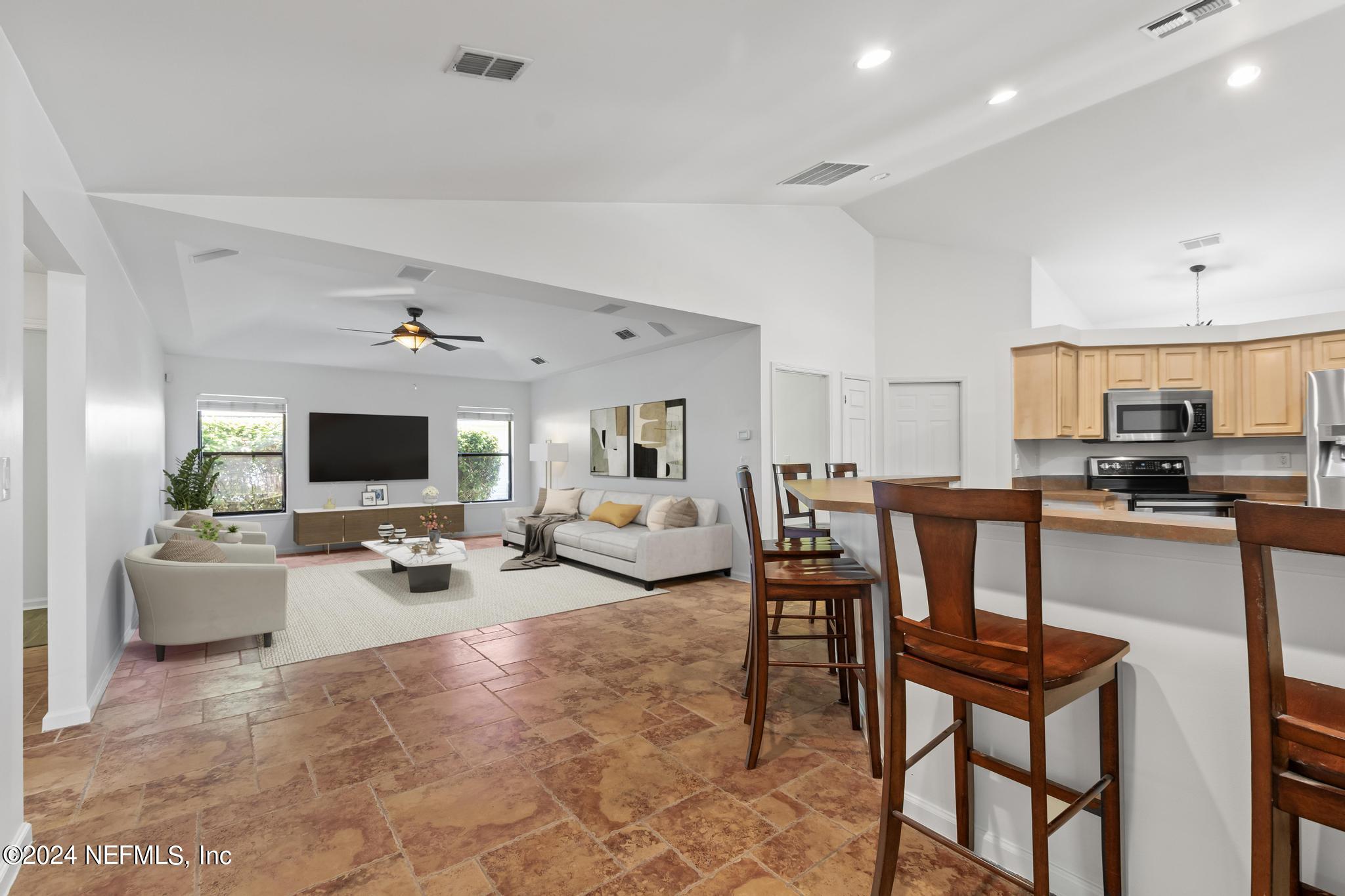 2949 Turning Leaf Lane Jacksonville, FL 32221 - Photo 53 of 116 a living room with furniture and a flat screen tv