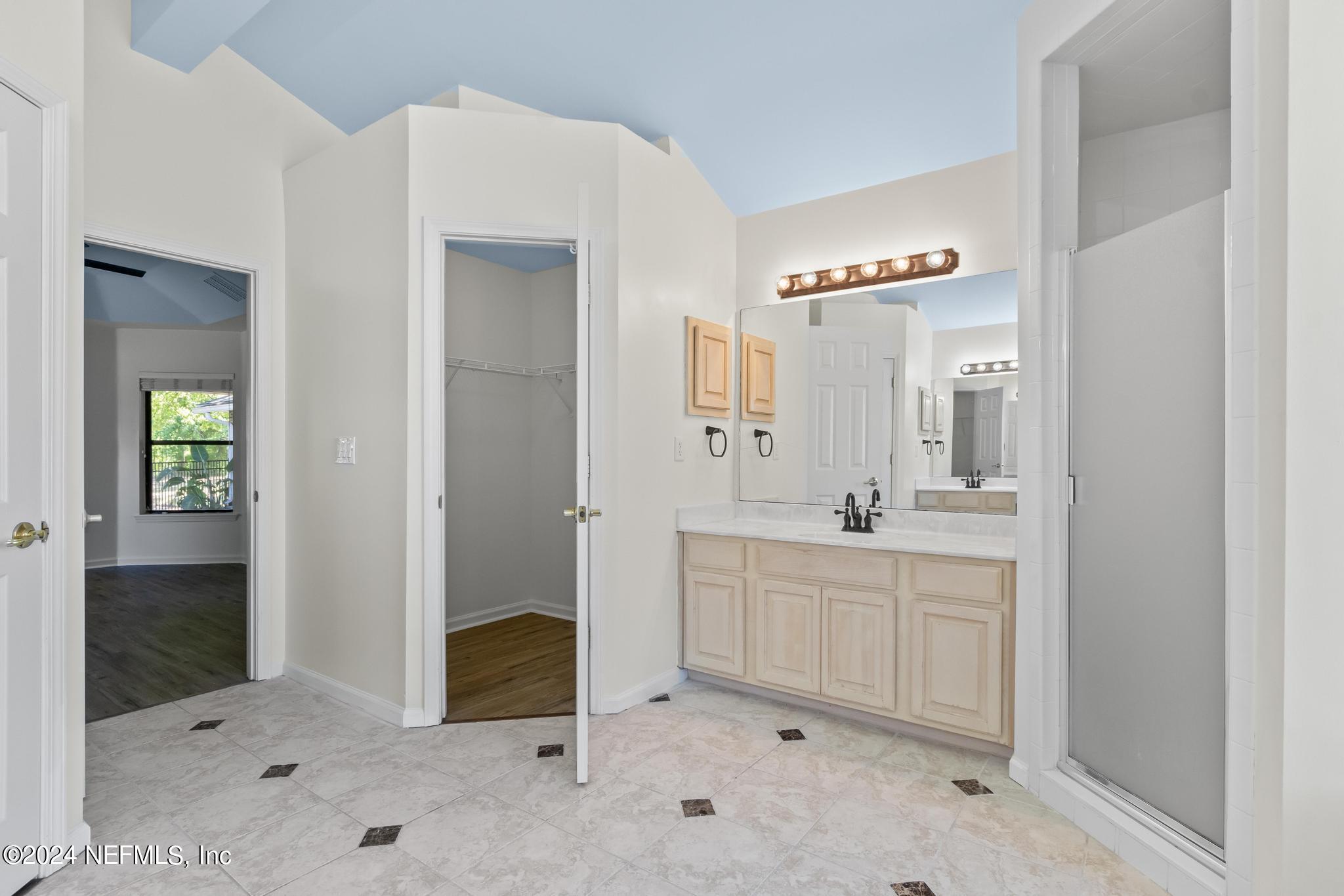 2949 Turning Leaf Lane Jacksonville, FL 32221 - Photo 68 of 116 a spacious bathroom with a mirror sink and shower