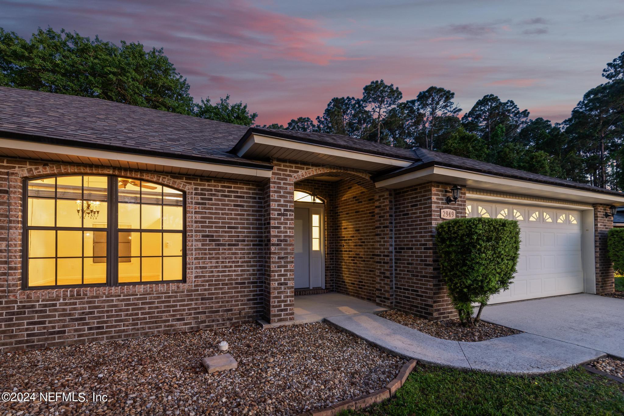 2949 Turning Leaf Lane Jacksonville, FL 32221 - Photo 7 of 116 a front view of a house with garden