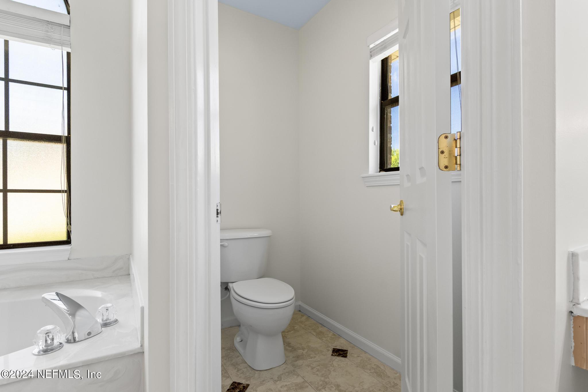 2949 Turning Leaf Lane Jacksonville, FL 32221 - Photo 71 of 116 a bathroom with a toilet and a shower