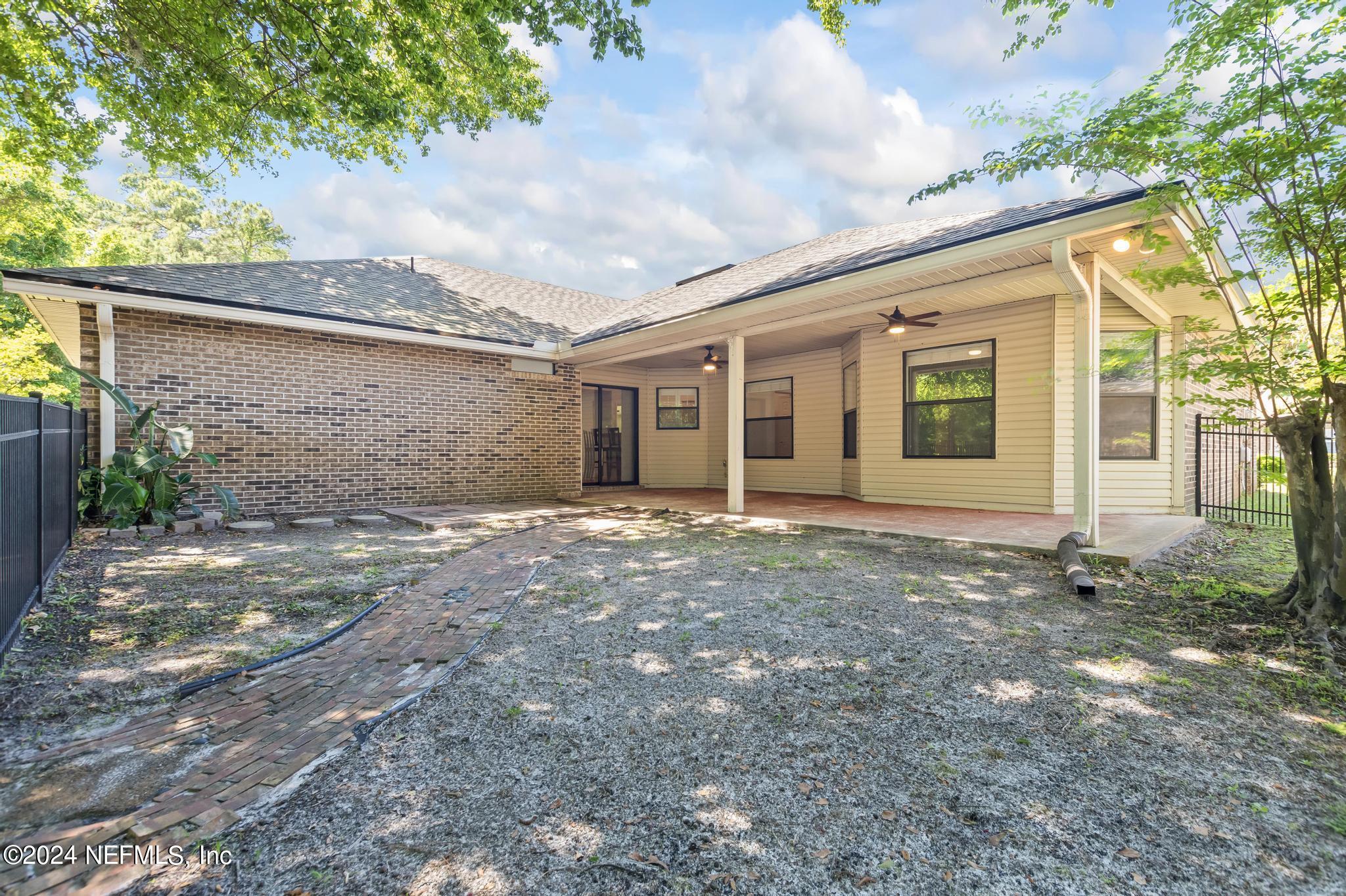 2949 Turning Leaf Lane Jacksonville, FL 32221 - Photo 97 of 116 a view of a house with a yard