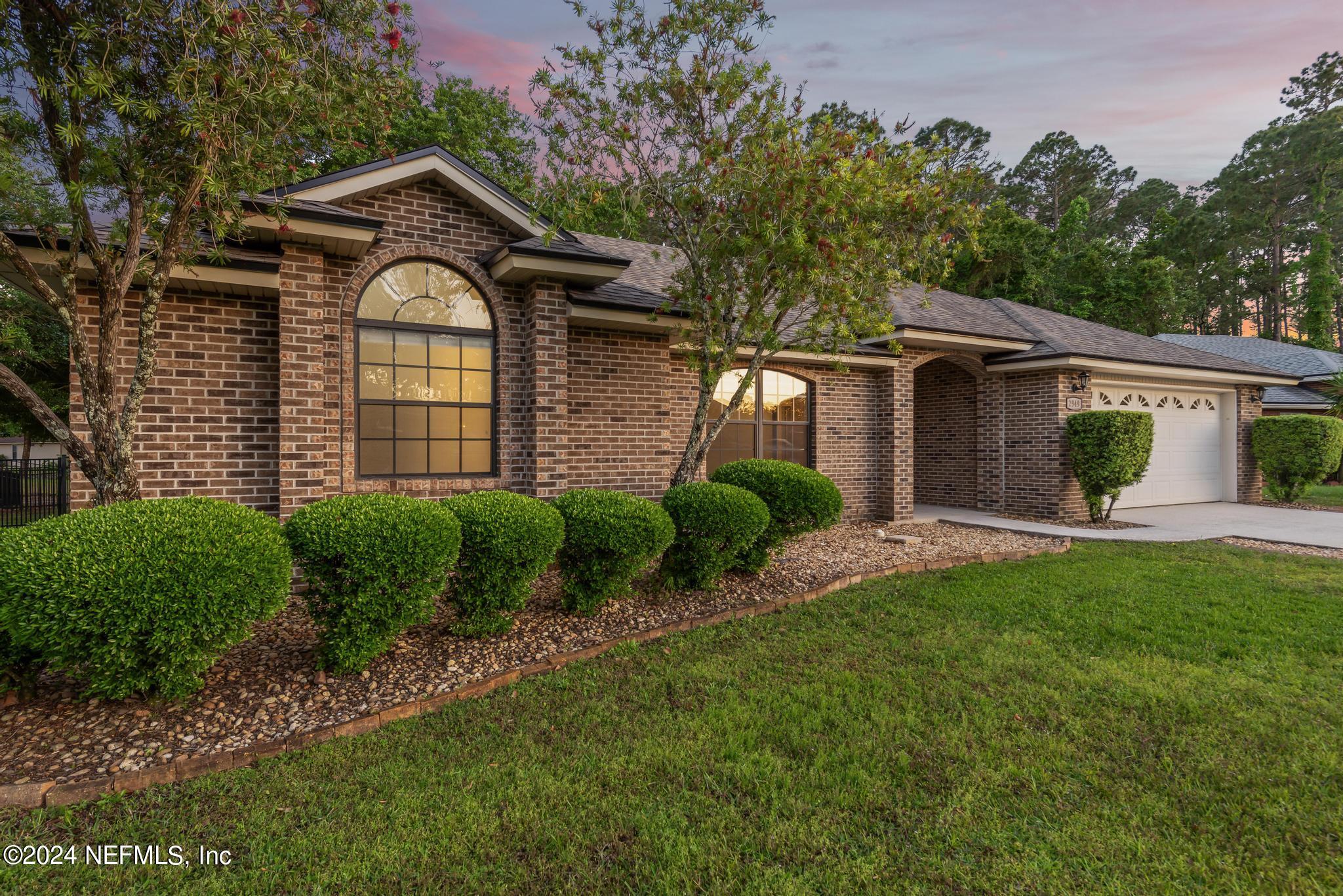 2949 Turning Leaf Lane Jacksonville, FL 32221 - Photo 10 of 116 a front view of a house with garden
