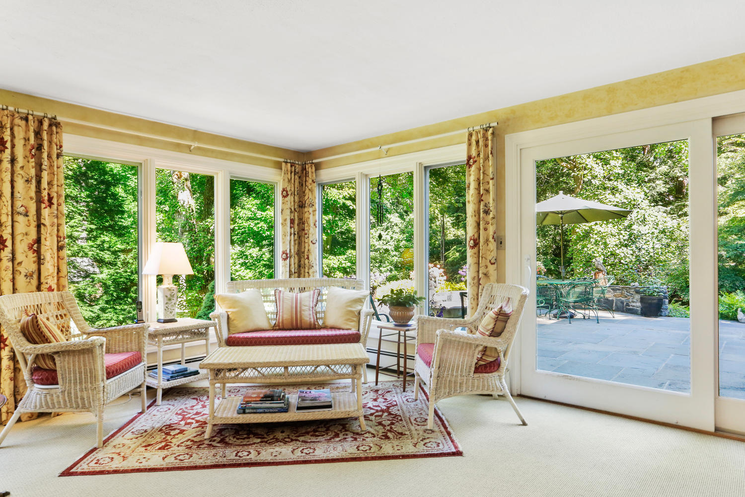 573 Valley Road New Canaan, CT 06840 - Photo 11 of 53 a living room with furniture and a floor to ceiling window