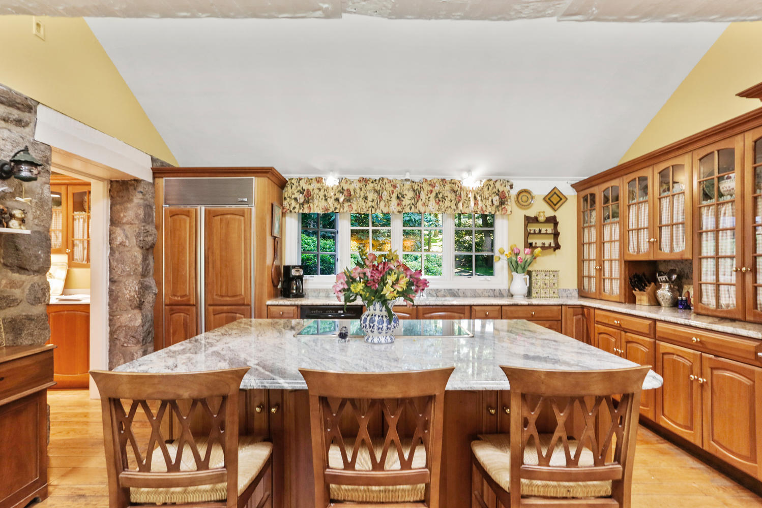 573 Valley Road New Canaan, CT 06840 - Photo 18 of 53 a view of a dining room with furniture and window