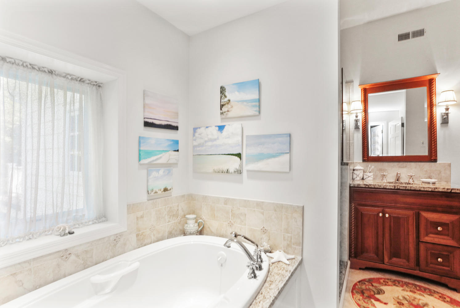 573 Valley Road New Canaan, CT 06840 - Photo 22 of 53 a bathroom with a tub sink and mirror