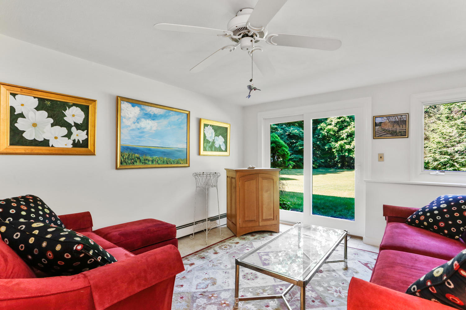 573 Valley Road New Canaan, CT 06840 - Photo 27 of 53 a living room with furniture and a floor to ceiling window