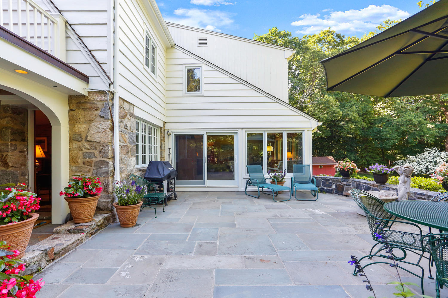 573 Valley Road New Canaan, CT 06840 - Photo 32 of 53 a view of a house with sitting area and furniture