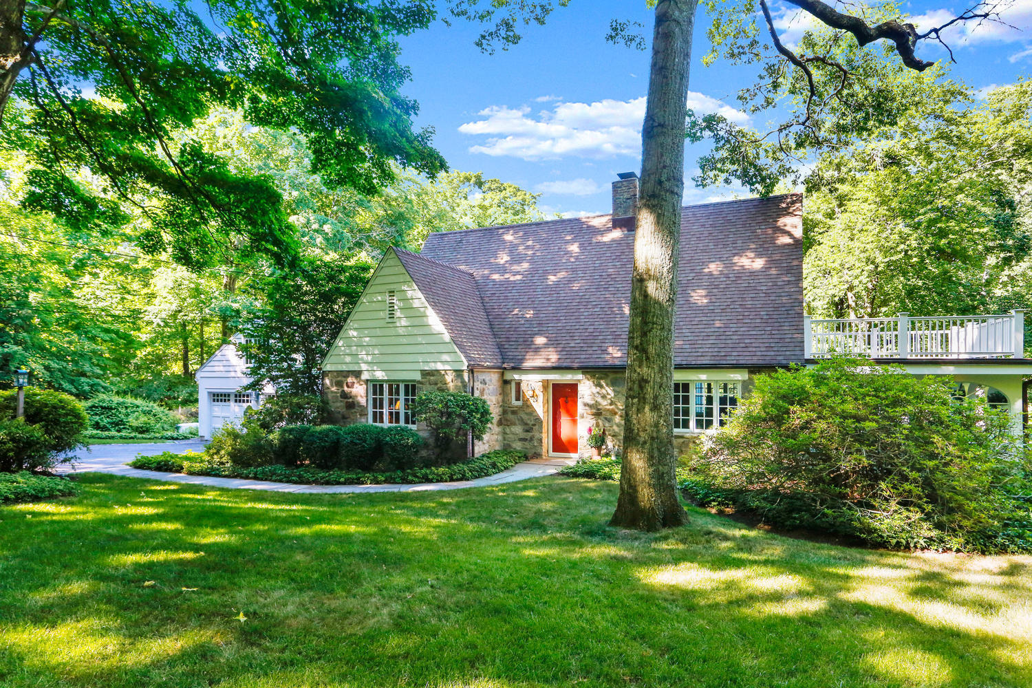 573 Valley Road New Canaan, CT 06840 - Photo 40 of 53 front view of house with a yard and potted plants