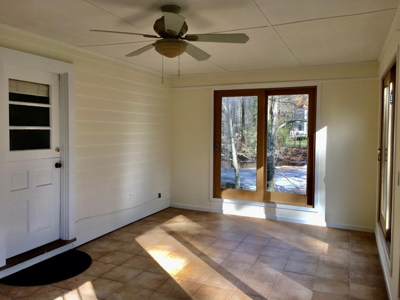 573 Valley Road New Canaan, CT 06840 - Photo 48 of 53 a view of an empty room with a window