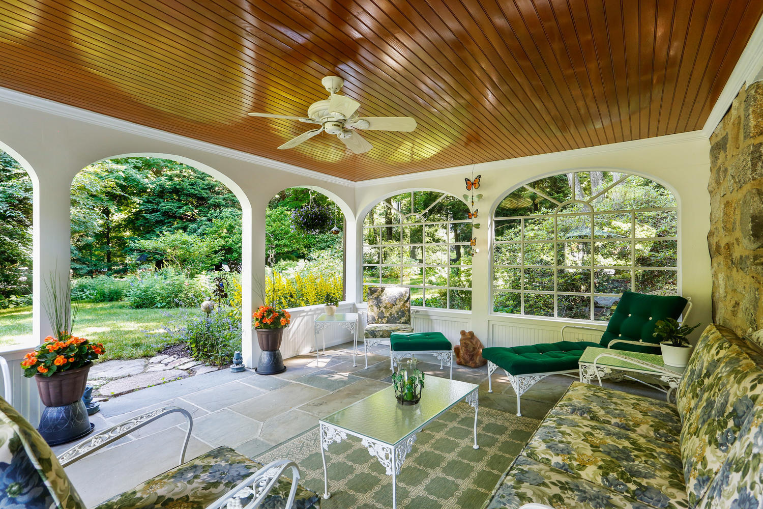 573 Valley Road New Canaan, CT 06840 - Photo 9 of 53 a view of a patio with couches chairs and a big yard