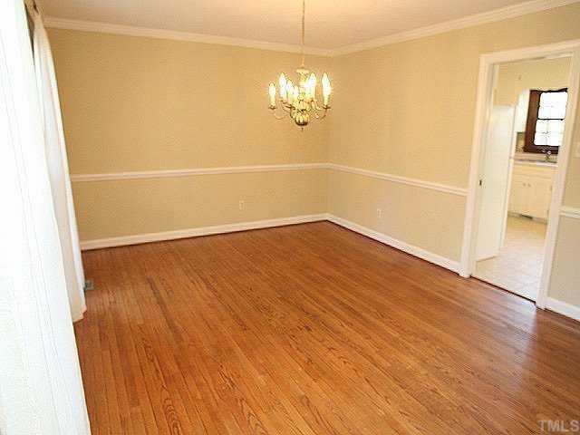 11808 Coachmans Way Raleigh, NC 27614 - Photo 3 of 12 wooden floor in an empty room with a window