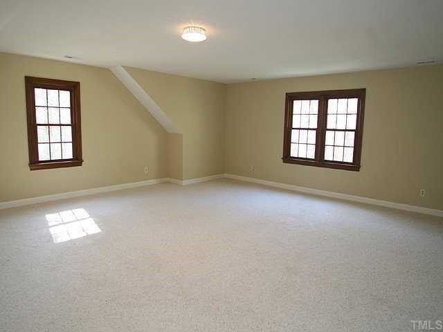 11808 Coachmans Way Raleigh, NC 27614 - Photo 8 of 12 an empty room with windows
