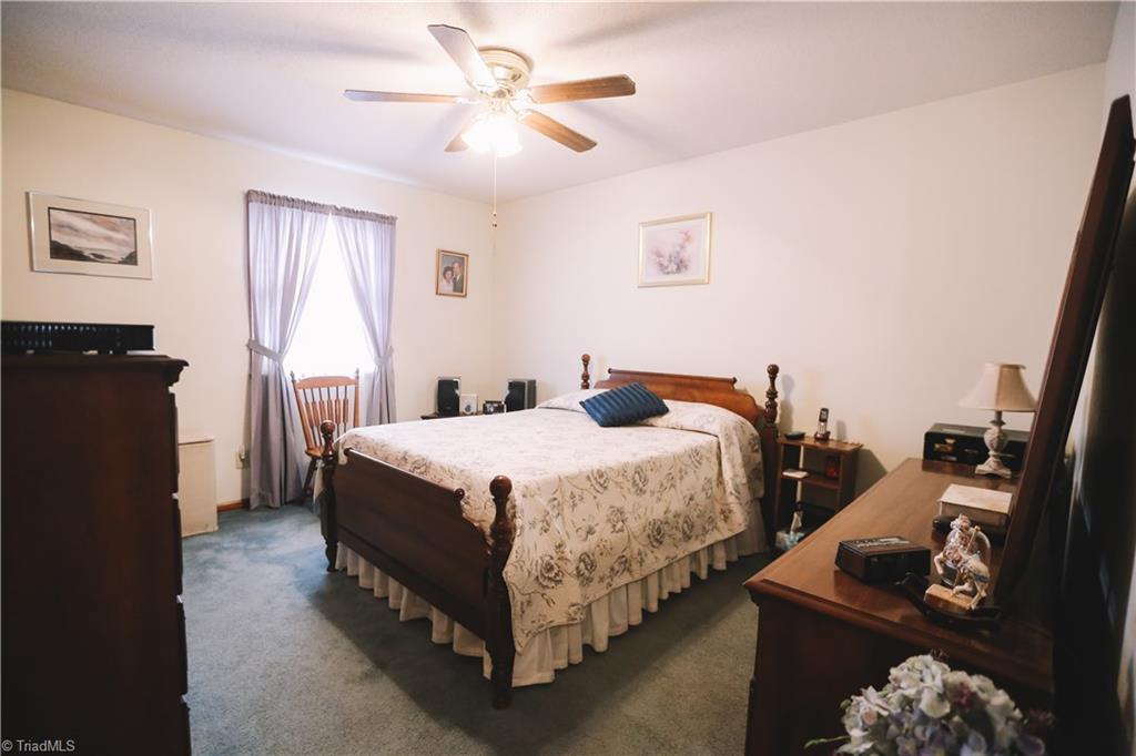 3103 Rockingham Road High Point, NC 27265 - Photo 18 of 22 Master bedroom is spacious with ceiling fan and large closet.