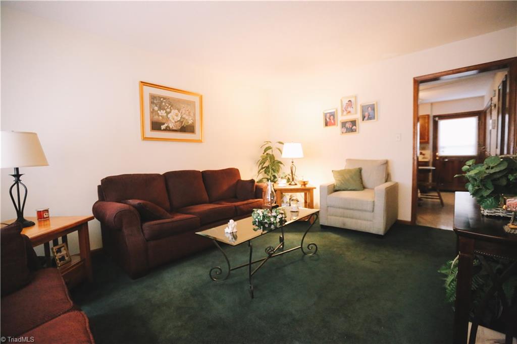 3103 Rockingham Road High Point, NC 27265 - Photo 3 of 22 Living room is open and spacious with large window letting in natural light.