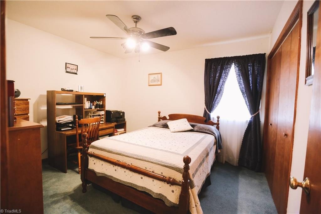 3103 Rockingham Road High Point, NC 27265 - Photo 21 of 22 Second bedroom has large closet and ceiling fan.