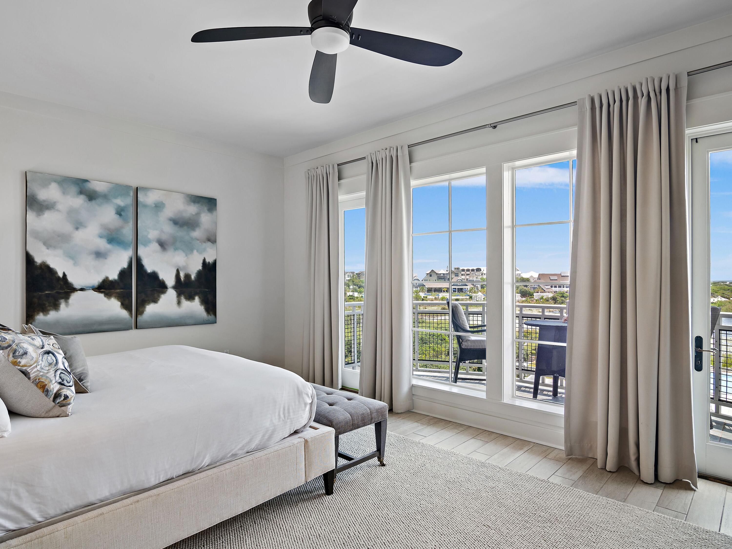 37 Compass Point Way South, Unit 421 Inlet Beach, FL 32461 - Photo 9 of 30 a bedroom with a large bed and a painting on the wall