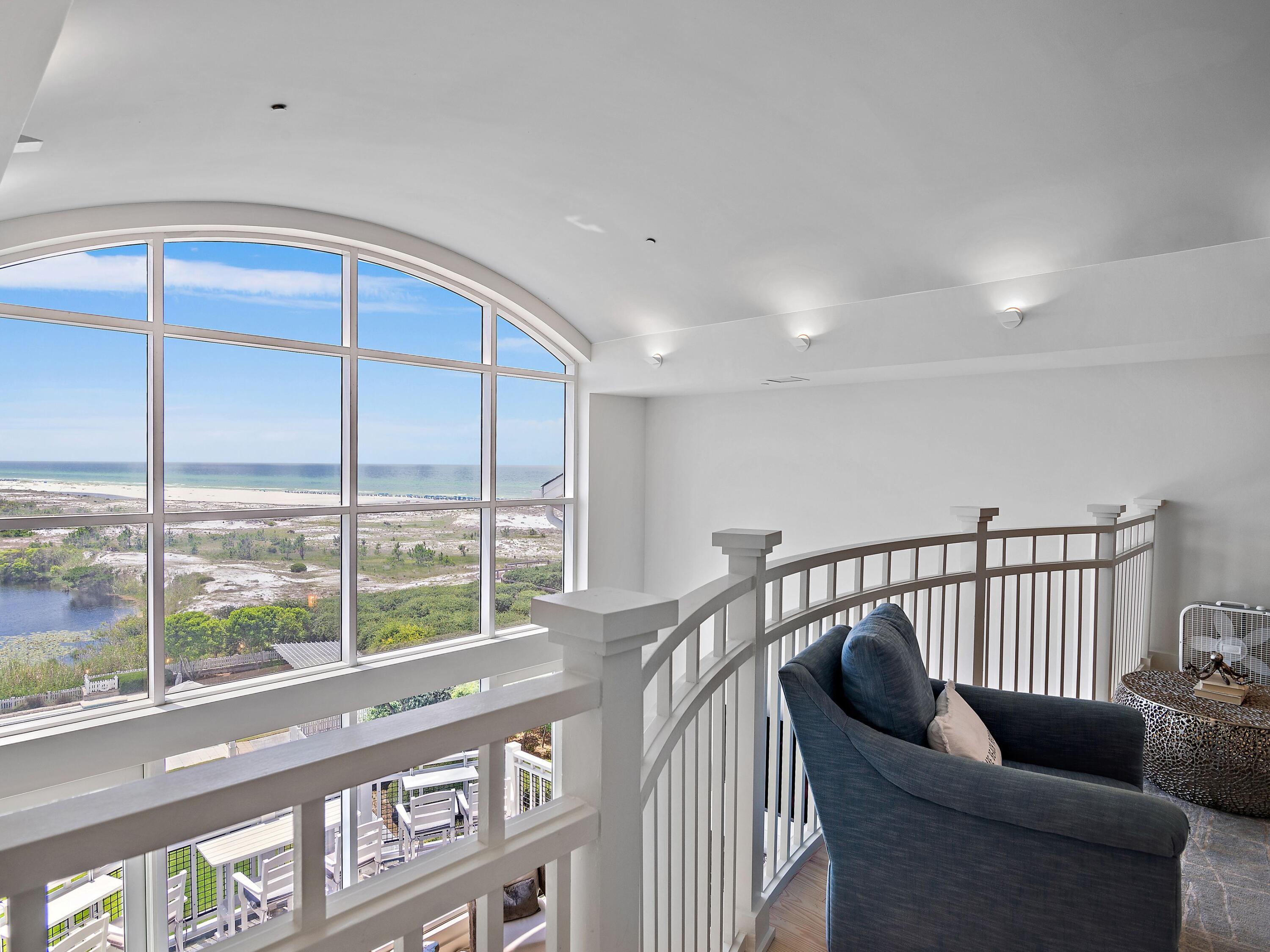 37 Compass Point Way South, Unit 421 Inlet Beach, FL 32461 - Photo 16 of 30 a balcony with furniture and a window