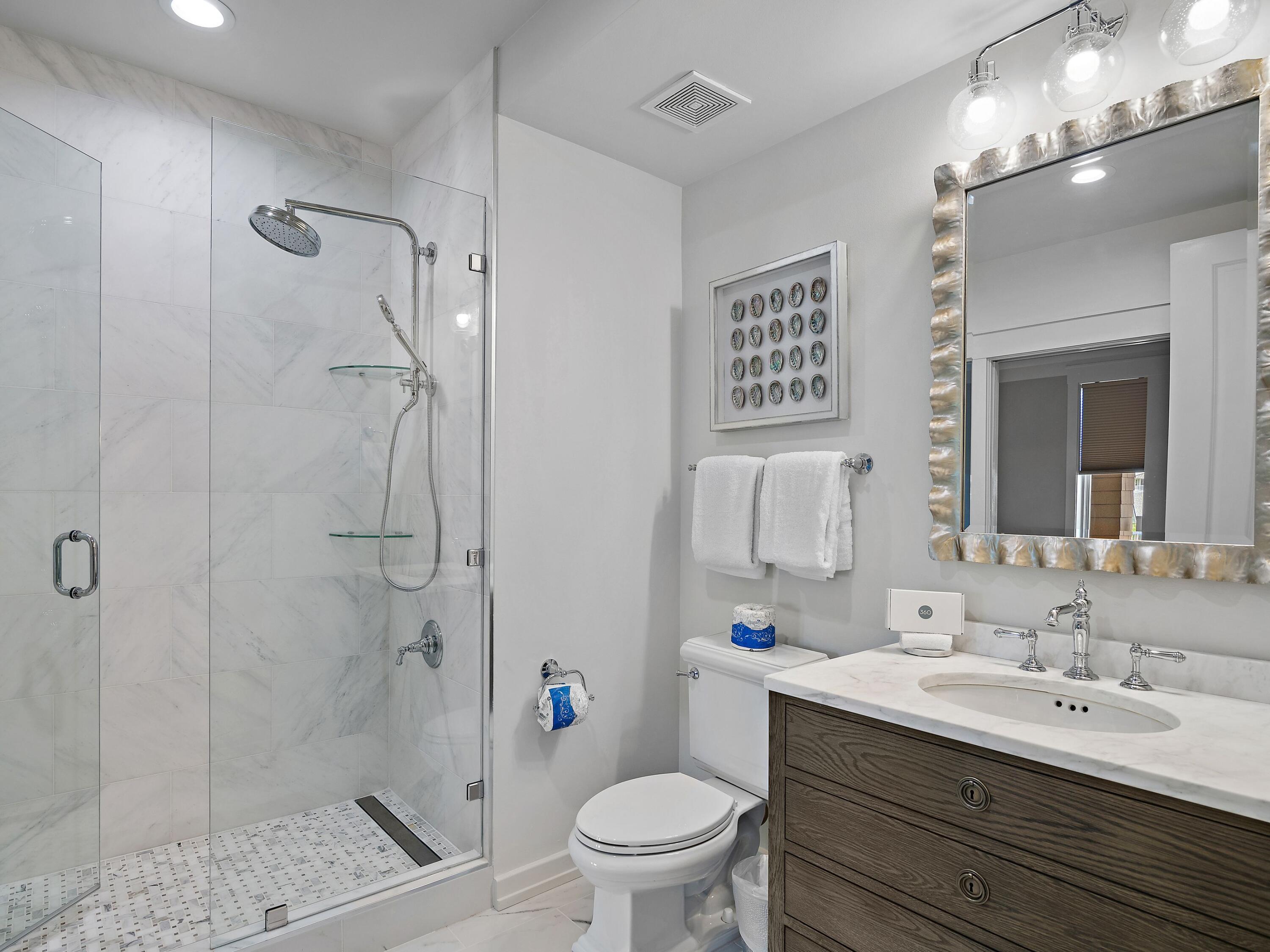 37 Compass Point Way South, Unit 421 Inlet Beach, FL 32461 - Photo 19 of 30 a bathroom with a sink a toilet and shower