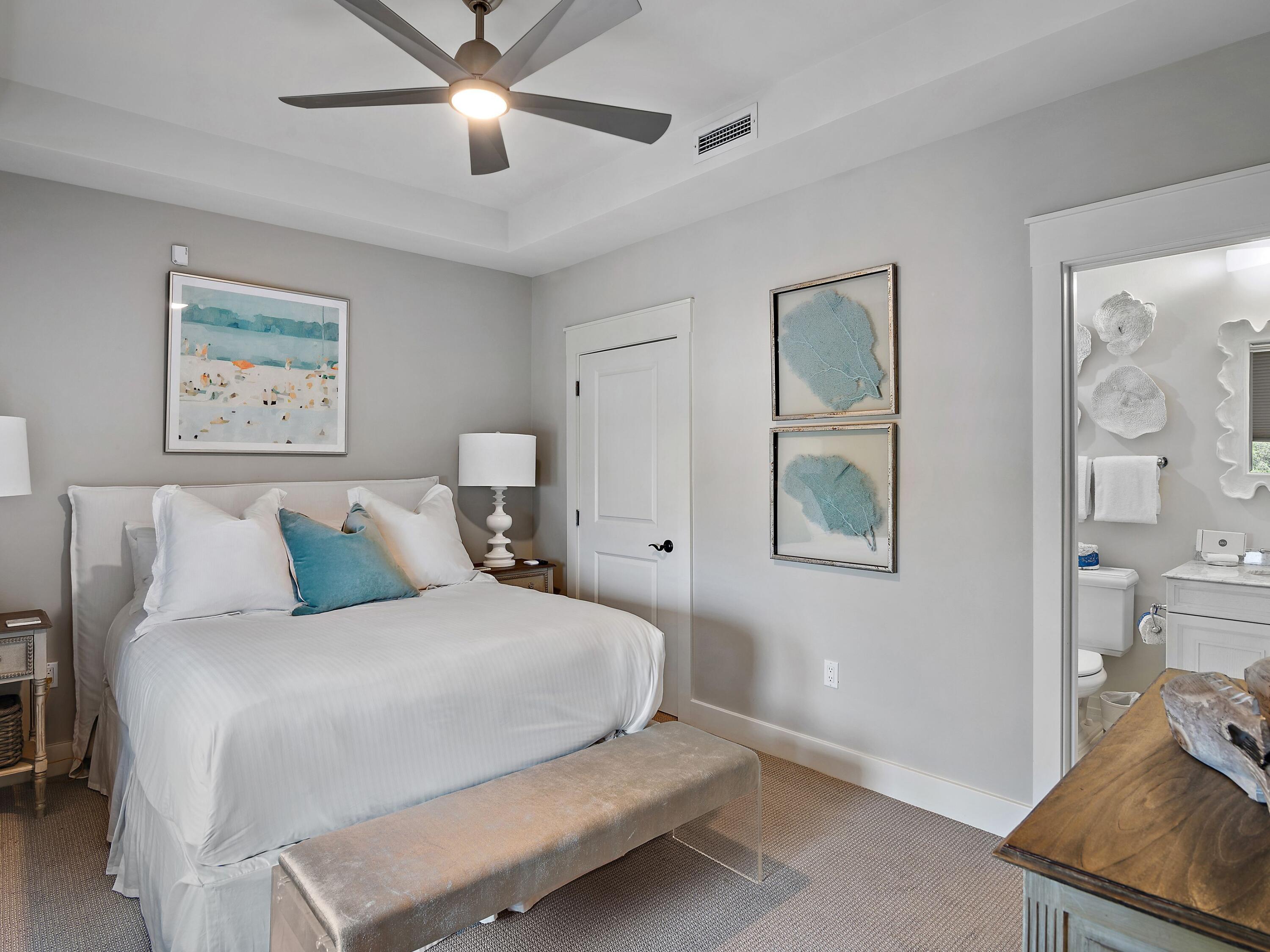 37 Compass Point Way South, Unit 421 Inlet Beach, FL 32461 - Photo 20 of 30 a bedroom with a bed and a chandelier