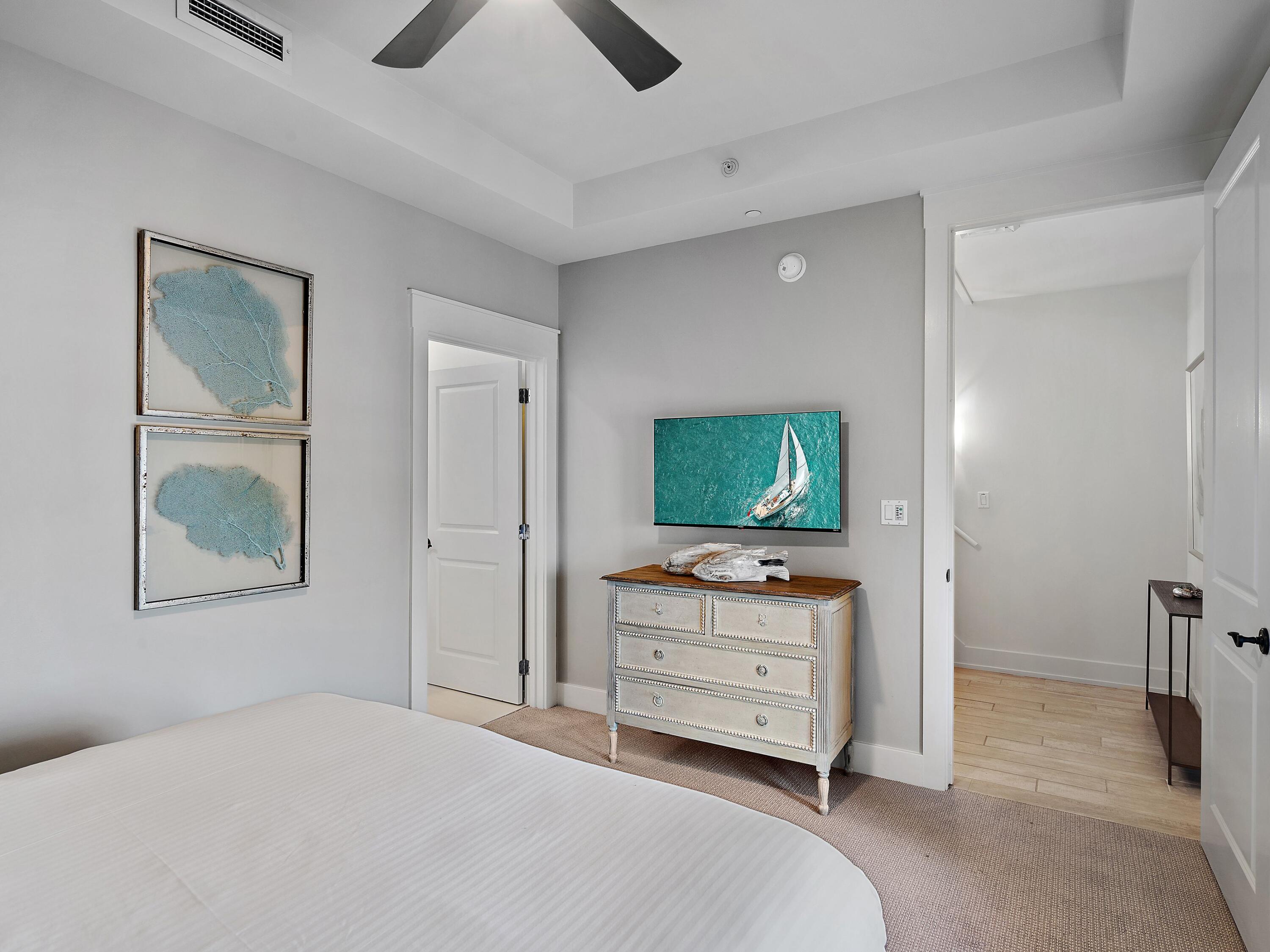 37 Compass Point Way South, Unit 421 Inlet Beach, FL 32461 - Photo 21 of 30 a bedroom with a bed and a television