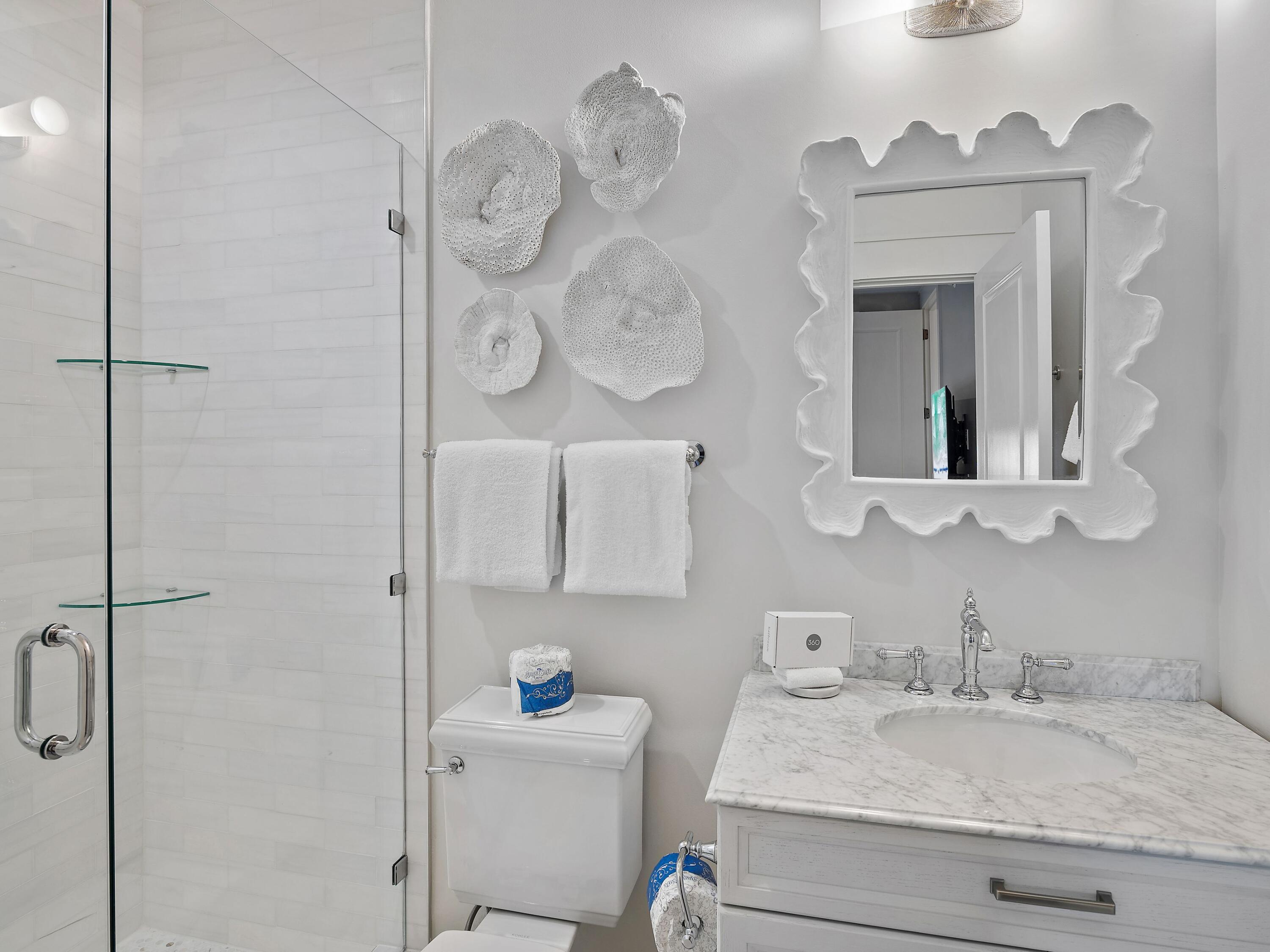 37 Compass Point Way South, Unit 421 Inlet Beach, FL 32461 - Photo 22 of 30 a bathroom with a granite countertop sink mirror vanity and toilet