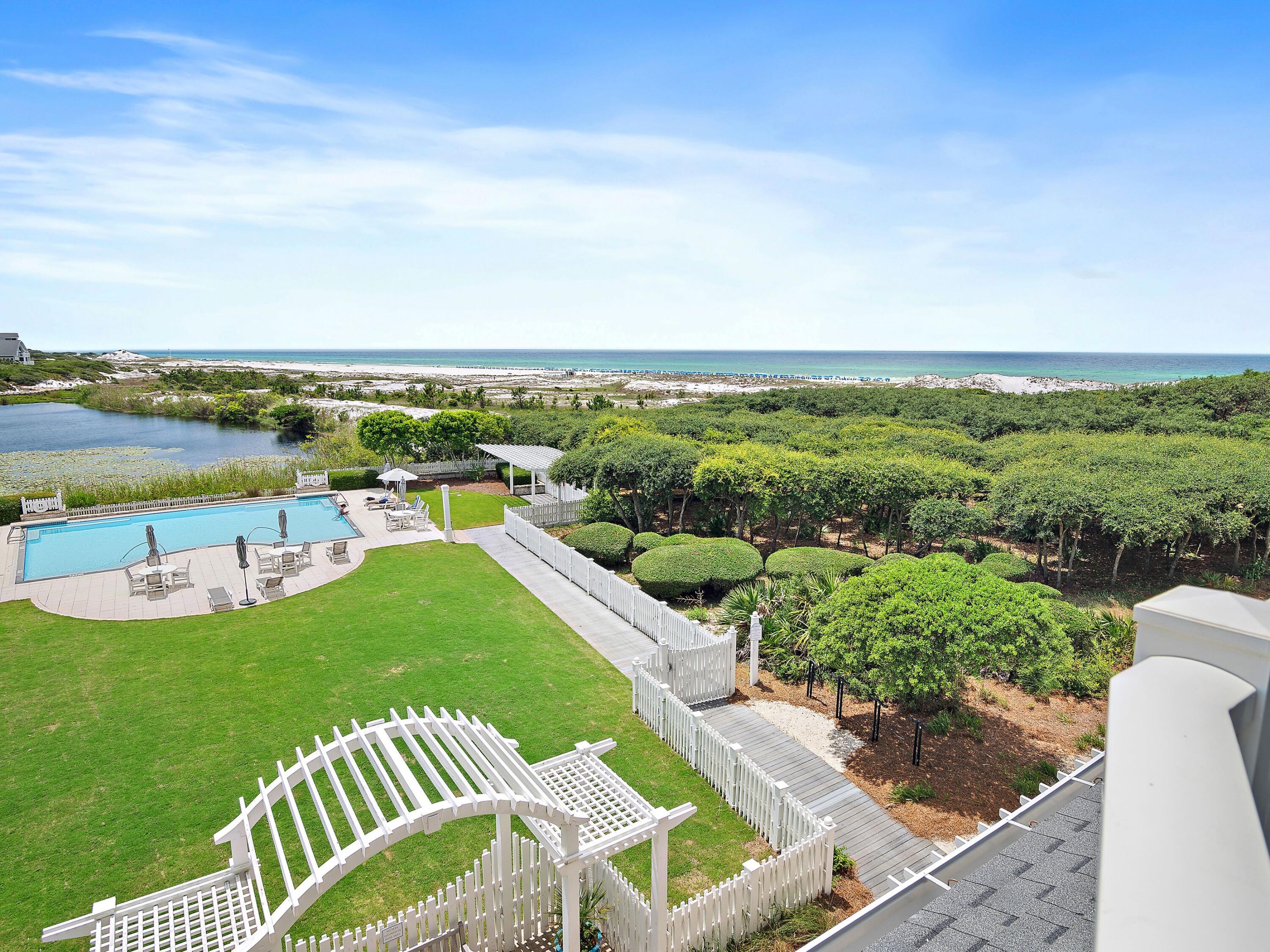 37 Compass Point Way South, Unit 421 Inlet Beach, FL 32461 - Photo 23 of 30 a view of a swimming pool with a garden