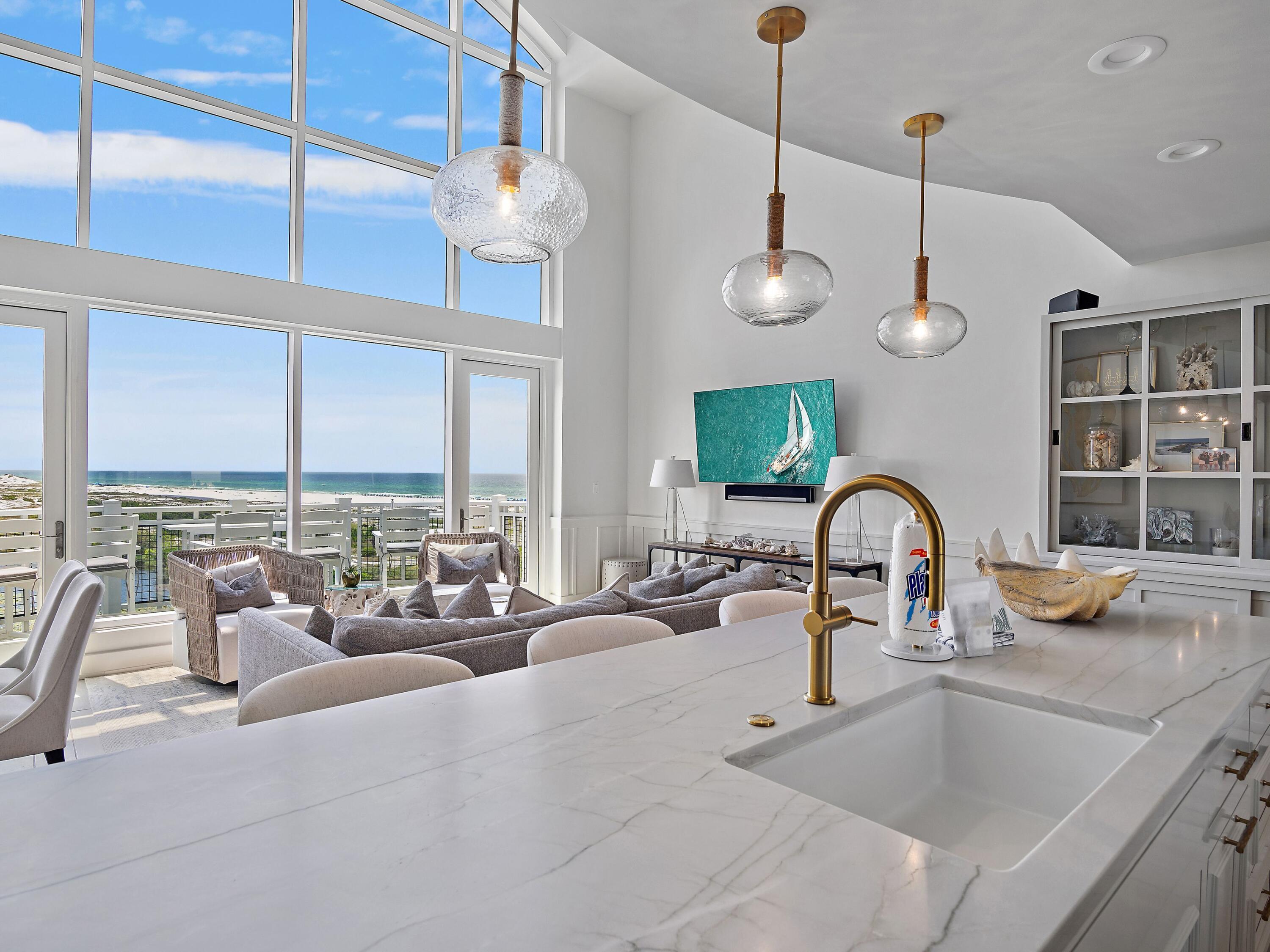 37 Compass Point Way South, Unit 421 Inlet Beach, FL 32461 - Photo 30 of 30 a kitchen with a large window cabinets a sink and stainless steel appliances