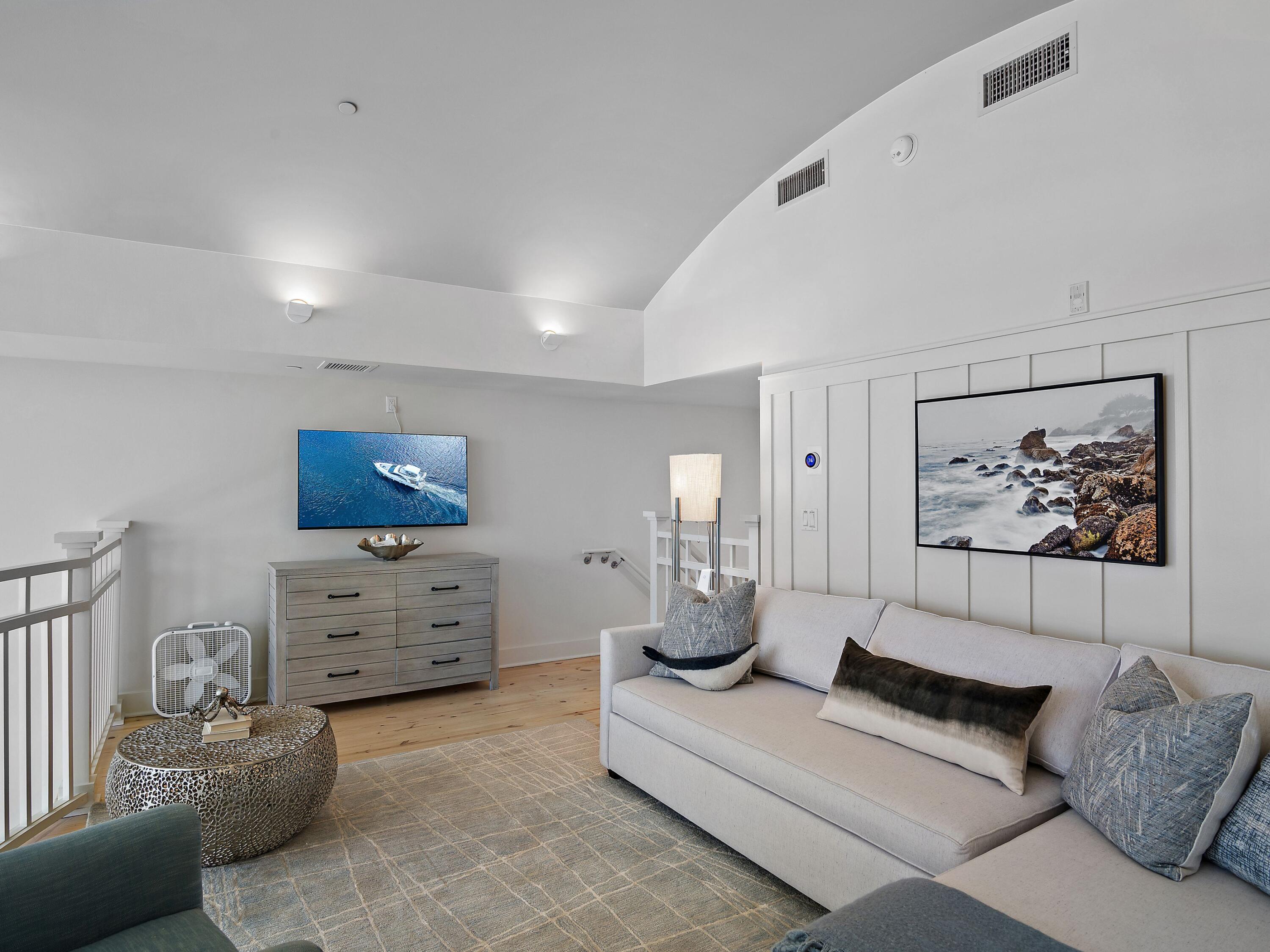 37 Compass Point Way South, Unit 421 Inlet Beach, FL 32461 - Photo 27 of 30 a living room with furniture and paintings on the wall