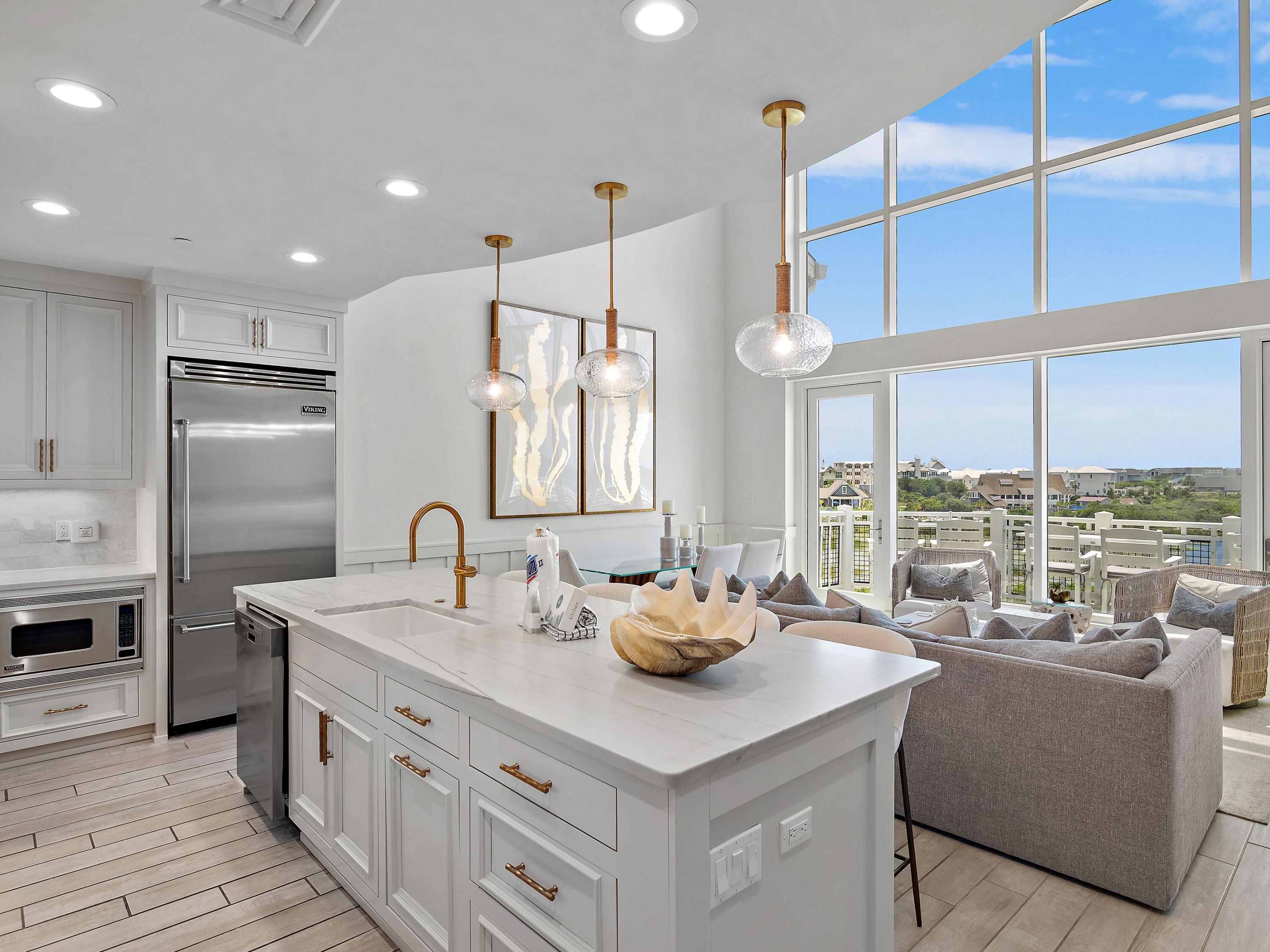 37 Compass Point Way South, Unit 421 Inlet Beach, FL 32461 - Photo 28 of 30 a kitchen with stainless steel appliances kitchen island granite countertop a sink and a refrigerator