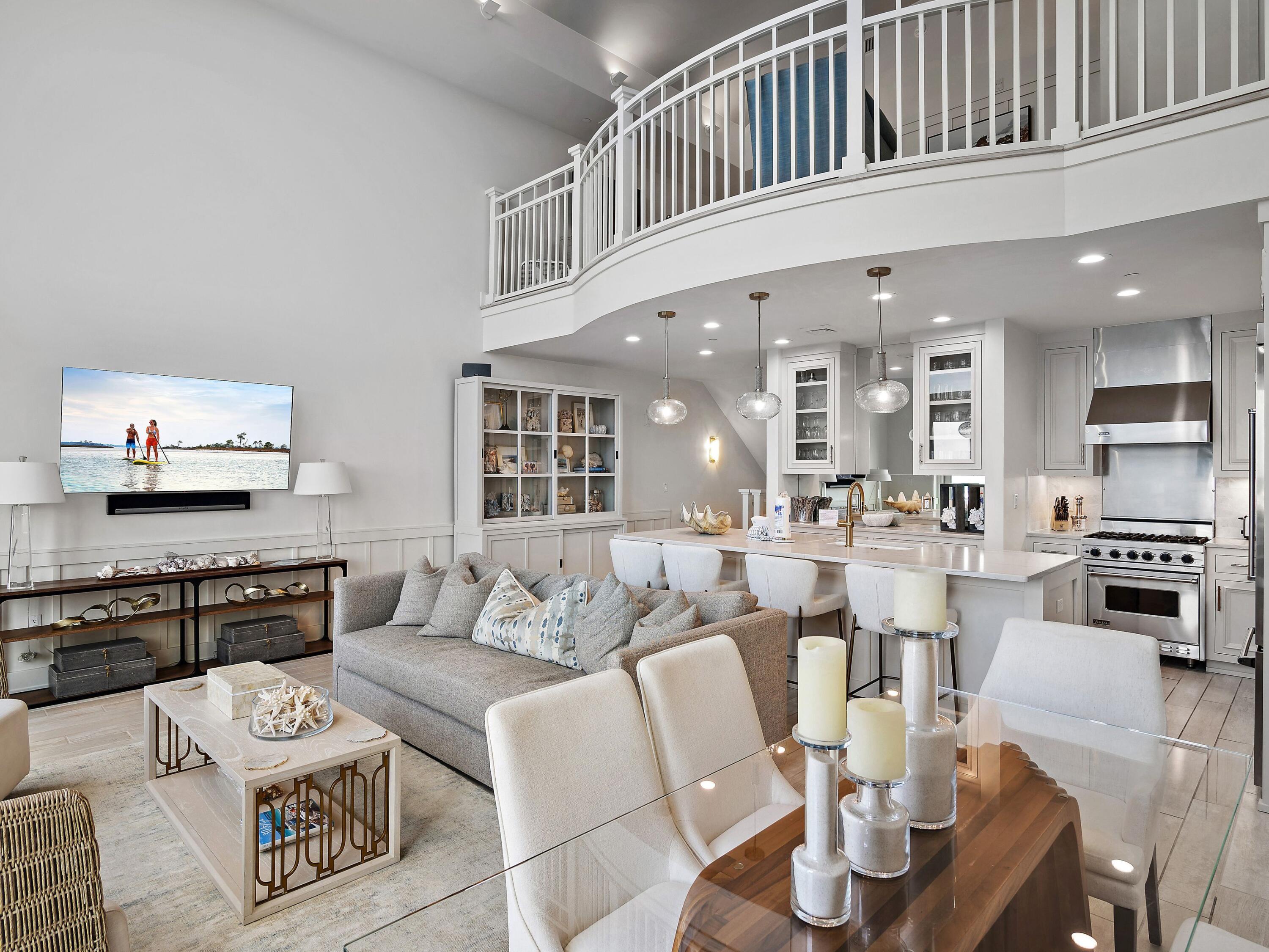 37 Compass Point Way South, Unit 421 Inlet Beach, FL 32461 - Photo 29 of 30 a living room with furniture kitchen view and a table