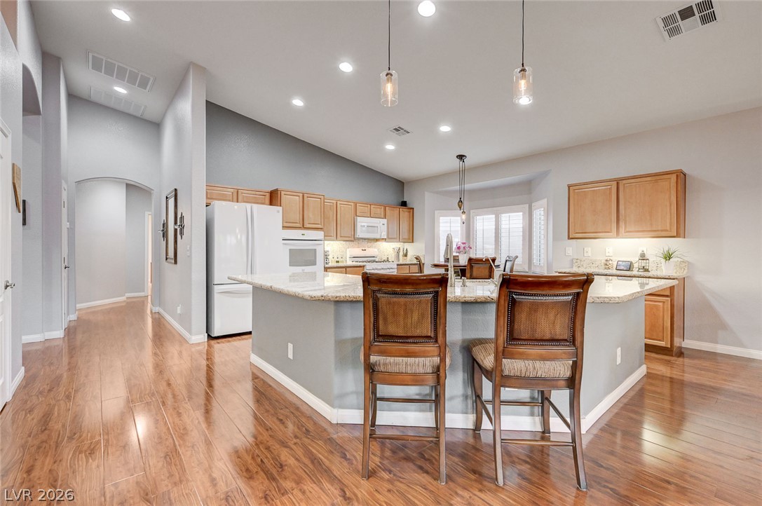 1604 Cattle Ranch Place Henderson, NV 89002 - Photo 18 of 99 A gourmet kitchen offers ample counter space, abundant cabinetry, and a generous island.