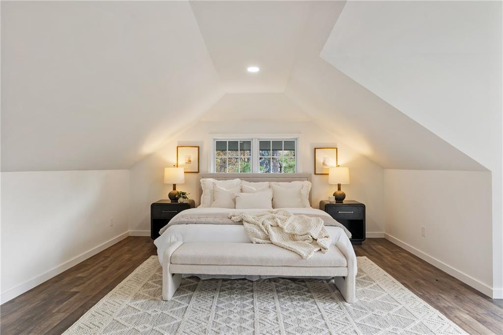 14440 Cogburn Road Alpharetta, GA 30004 - Photo 27 of 62 a bedroom with a bed and a large window
